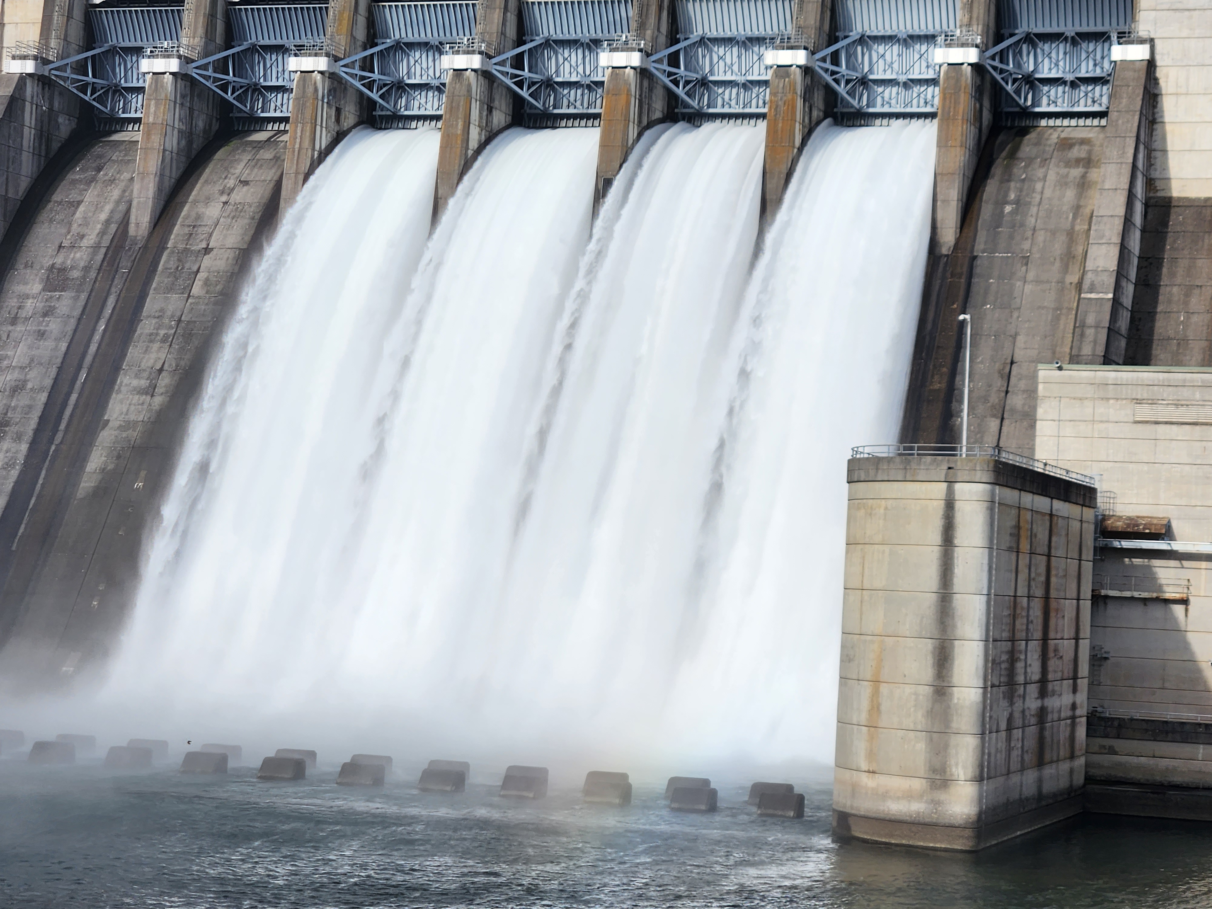 Beaver Lake Dam spillway with water releasing into the White River downstream