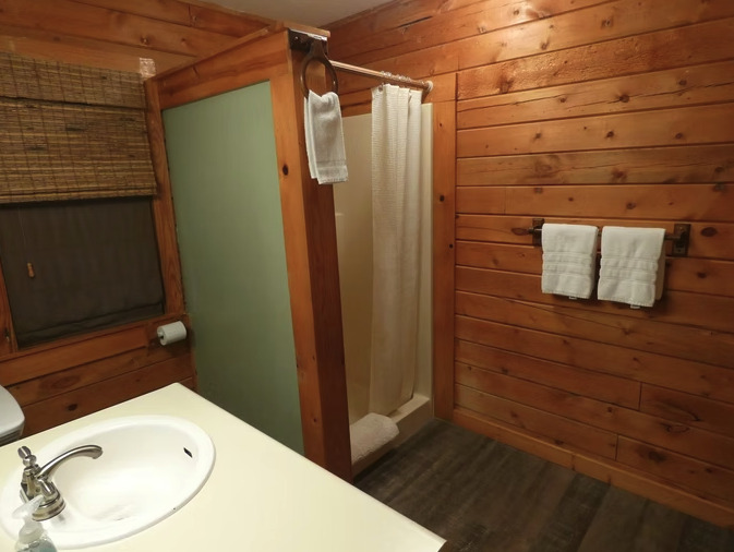 Cliffside cabin deck at golden hour